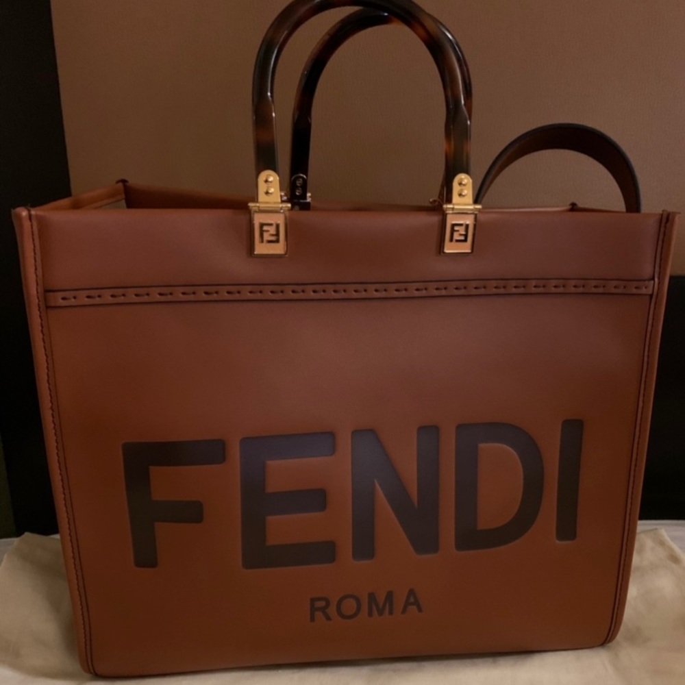 Medium Fendi Sunshine..Comes with shoulder strap and dust bag.